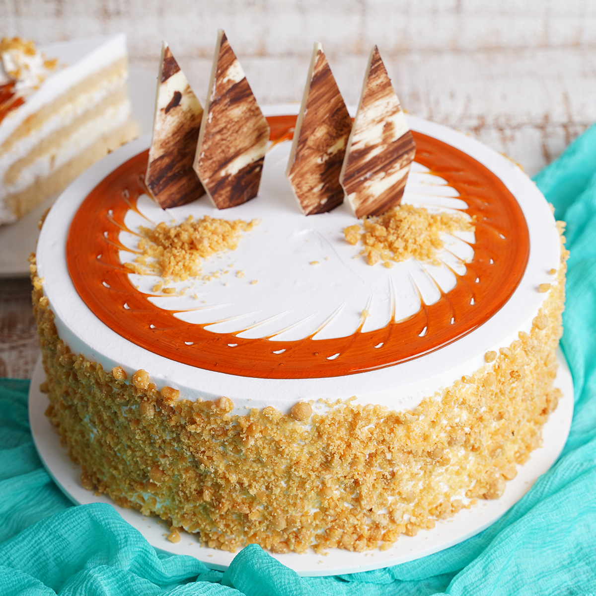 Send Crunchy Butterscotch Cake With Rakhi Online in India at Indiagift.in