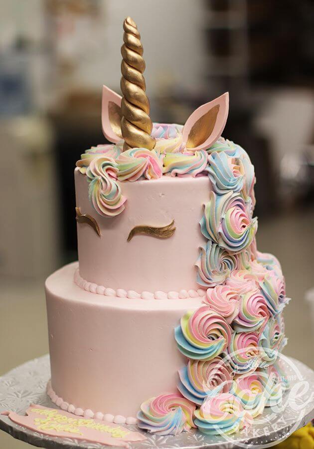 Pink Unicorn WIth Rainbow Cream Floral Tier Cake